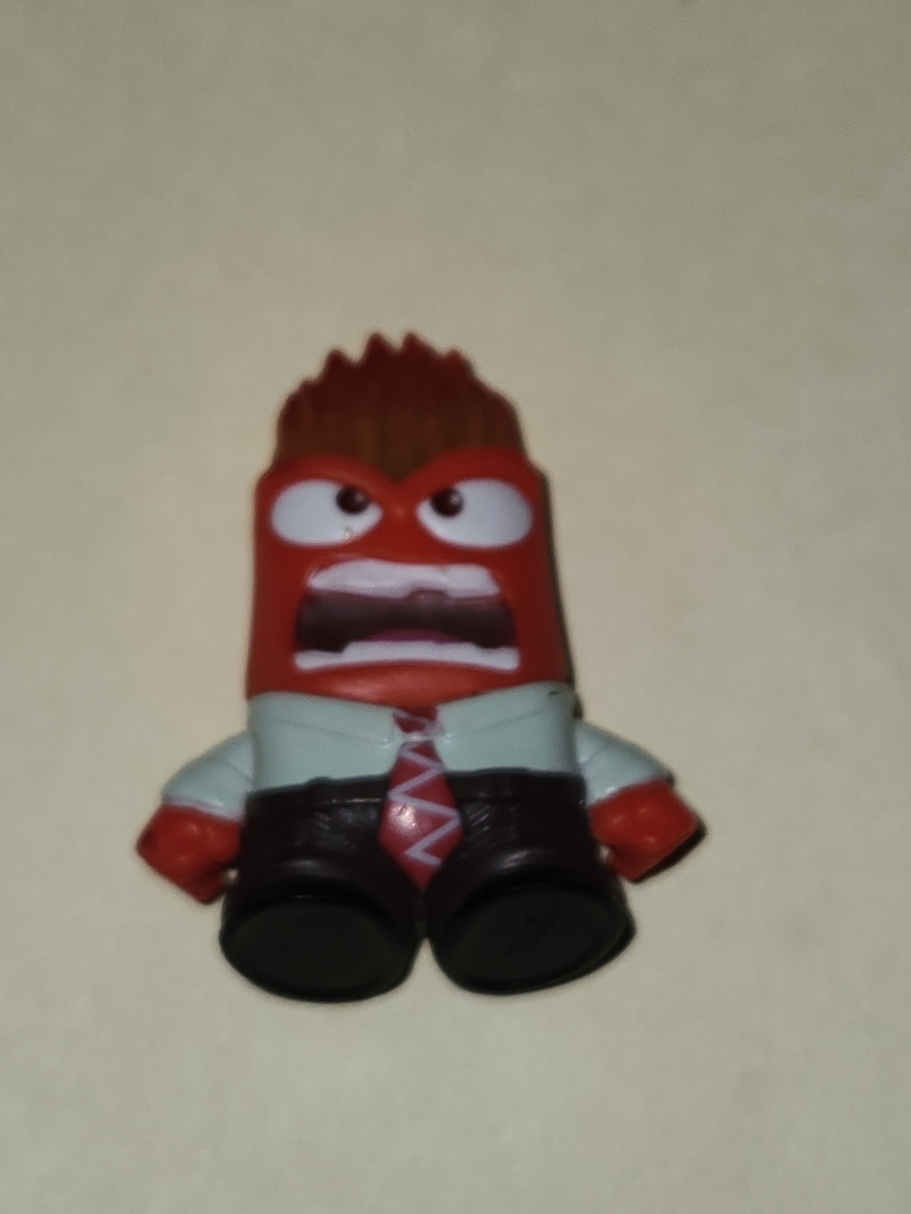 Source Unknown Red Angry Character Figure with Brown Hair and Black Shoes